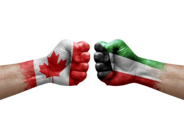 Two hands punch to each others on white background. Country flags painted fists, conflict crisis concept between canada and kuwait