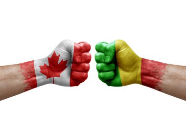Two hands punch to each others on white background. Country flags painted fists, conflict crisis concept between canada and mali