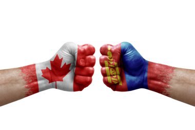 Two hands punch to each others on white background. Country flags painted fists, conflict crisis concept between canada and mongolia