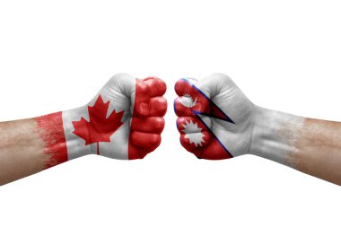 Two hands punch to each others on white background. Country flags painted fists, conflict crisis concept between canada and nepal