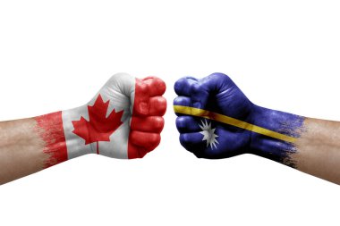 Two hands punch to each others on white background. Country flags painted fists, conflict crisis concept between canada and nauru