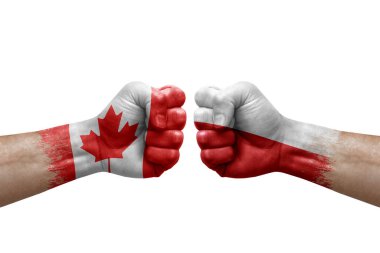 Two hands punch to each others on white background. Country flags painted fists, conflict crisis concept between canada and poland