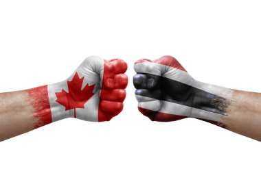 Two hands punch to each others on white background. Country flags painted fists, conflict crisis concept between canada and thailand