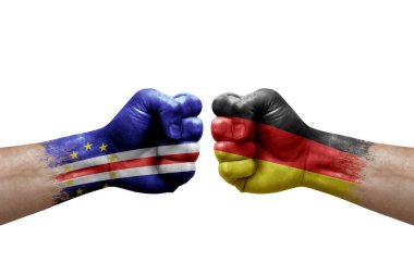 Two hands punch to each others on white background. Country flags painted fists, conflict crisis concept between cape verde and germany