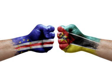 Two hands punch to each others on white background. Country flags painted fists, conflict crisis concept between cape verde and mozambique