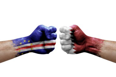 Two hands punch to each others on white background. Country flags painted fists, conflict crisis concept between cape verde and qatar