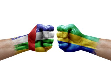 Two hands punch to each others on white background. Country flags painted fists, conflict crisis concept between central african republic and gabon