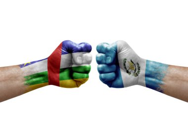Two hands punch to each others on white background. Country flags painted fists, conflict crisis concept between central african republic and guatemala