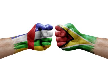 Two hands punch to each others on white background. Country flags painted fists, conflict crisis concept between central african republic and guyana
