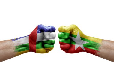 Two hands punch to each others on white background. Country flags painted fists, conflict crisis concept between central african republic and myanmar