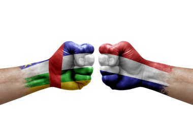 Two hands punch to each others on white background. Country flags painted fists, conflict crisis concept between central african republic and netherlands