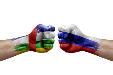 Two hands punch to each others on white background. Country flags painted fists, conflict crisis concept between central african republic and russia