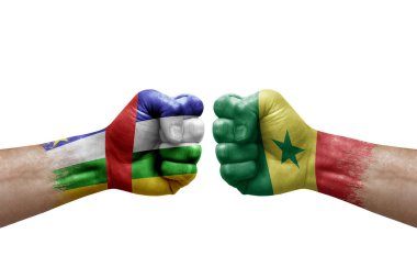 Two hands punch to each others on white background. Country flags painted fists, conflict crisis concept between central african republic and senegal