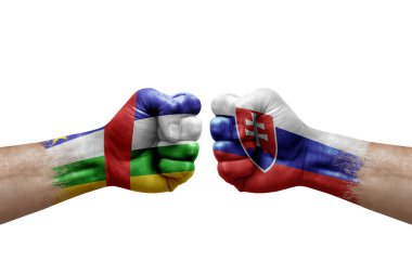 Two hands punch to each others on white background. Country flags painted fists, conflict crisis concept between central african republic and slovakia