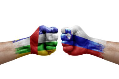 Two hands punch to each others on white background. Country flags painted fists, conflict crisis concept between central african republic and slovenia