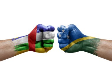 Two hands punch to each others on white background. Country flags painted fists, conflict crisis concept between central african republic and solomon islands