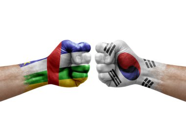 Two hands punch to each others on white background. Country flags painted fists, conflict crisis concept between central african republic and south korea