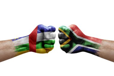 Two hands punch to each others on white background. Country flags painted fists, conflict crisis concept between central african republic and south africa