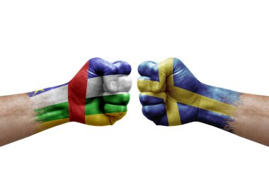 Two hands punch to each others on white background. Country flags painted fists, conflict crisis concept between central african republic and sweden