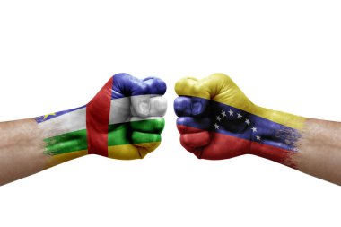 Two hands punch to each others on white background. Country flags painted fists, conflict crisis concept between central african republic and venezuela