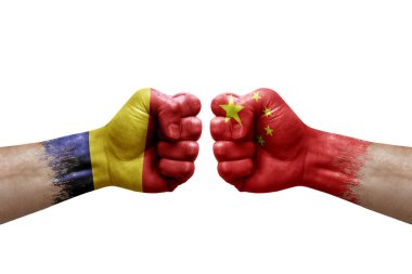 Two hands punch to each others on white background. Country flags painted fists, conflict crisis concept between chad and china
