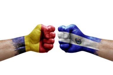 Two hands punch to each others on white background. Country flags painted fists, conflict crisis concept between chad and el salvador