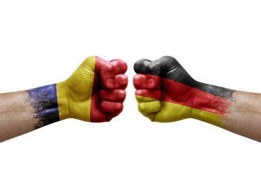 Two hands punch to each others on white background. Country flags painted fists, conflict crisis concept between chad and germany