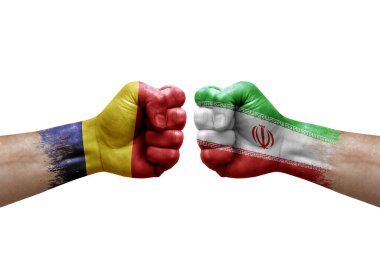 Two hands punch to each others on white background. Country flags painted fists, conflict crisis concept between chad and iran