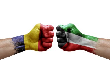 Two hands punch to each others on white background. Country flags painted fists, conflict crisis concept between chad and kuwait