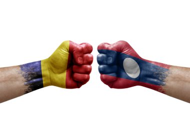 Two hands punch to each others on white background. Country flags painted fists, conflict crisis concept between chad and laos