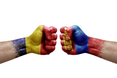 Two hands punch to each others on white background. Country flags painted fists, conflict crisis concept between chad and mongolia