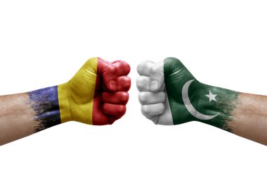 Two hands punch to each others on white background. Country flags painted fists, conflict crisis concept between chad and pakistan