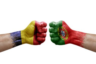 Two hands punch to each others on white background. Country flags painted fists, conflict crisis concept between chad and portugal