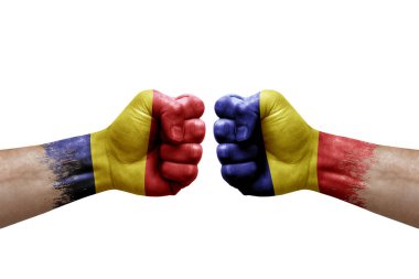 Two hands punch to each others on white background. Country flags painted fists, conflict crisis concept between chad and romania