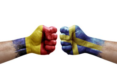 Two hands punch to each others on white background. Country flags painted fists, conflict crisis concept between chad and sweden