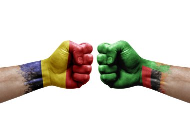 Two hands punch to each others on white background. Country flags painted fists, conflict crisis concept between chad and zambia