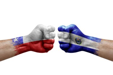 Two hands punch to each others on white background. Country flags painted fists, conflict crisis concept between chile and el salvador