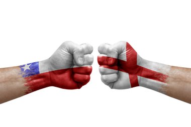 Two hands punch to each others on white background. Country flags painted fists, conflict crisis concept between chile and england