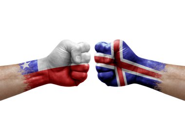 Two hands punch to each others on white background. Country flags painted fists, conflict crisis concept between chile and iceland
