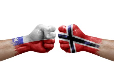 Two hands punch to each others on white background. Country flags painted fists, conflict crisis concept between chile and norway