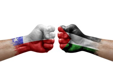 Two hands punch to each others on white background. Country flags painted fists, conflict crisis concept between chile and palestine