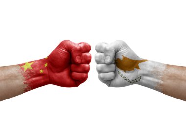 Two hands punch to each others on white background. Country flags painted fists, conflict crisis concept between china and cyprus