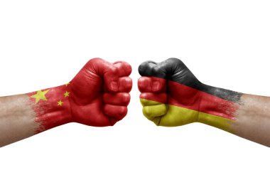 Two hands punch to each others on white background. Country flags painted fists, conflict crisis concept between china and germany