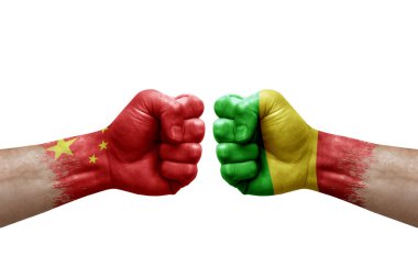 Two hands punch to each others on white background. Country flags painted fists, conflict crisis concept between china and mali