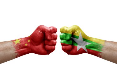 Two hands punch to each others on white background. Country flags painted fists, conflict crisis concept between china and myanmar