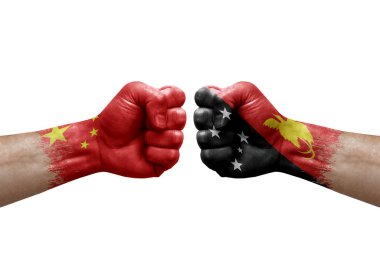 Two hands punch to each others on white background. Country flags painted fists, conflict crisis concept between china and papua new guinea