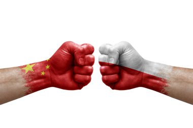 Two hands punch to each others on white background. Country flags painted fists, conflict crisis concept between china and poland