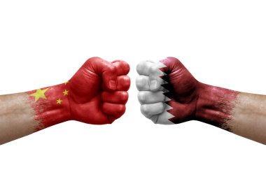 Two hands punch to each others on white background. Country flags painted fists, conflict crisis concept between china and qatar