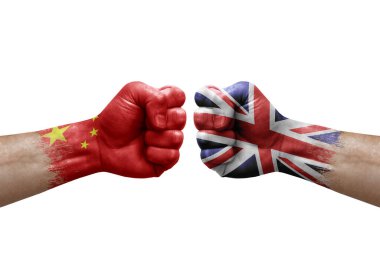 Two hands punch to each others on white background. Country flags painted fists, conflict crisis concept between china and united kingdom