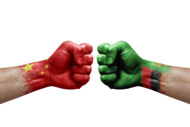 Two hands punch to each others on white background. Country flags painted fists, conflict crisis concept between china and zambia